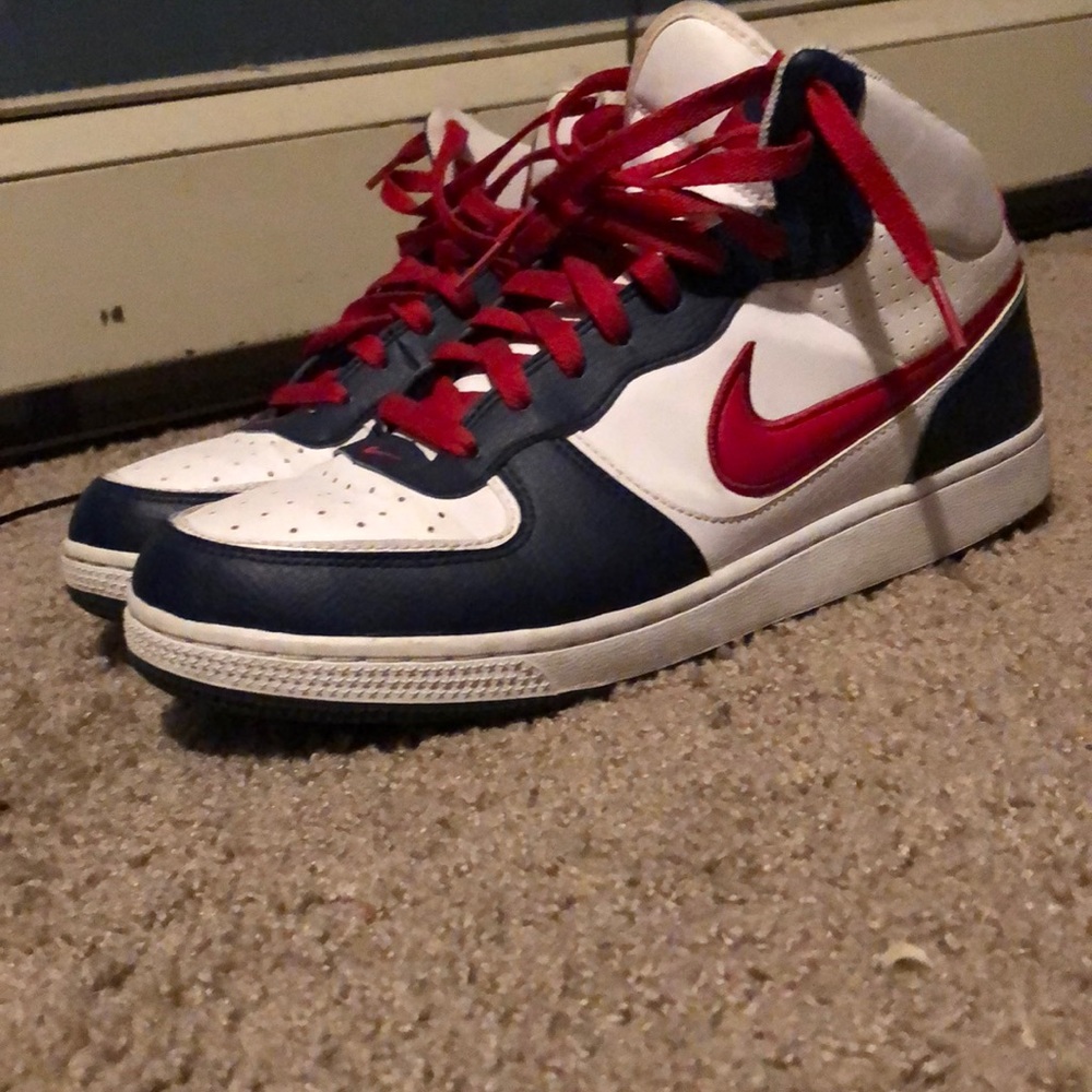 A pair of Nike high tops (red white and blue)